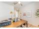 Bright home office with a wood desk and a ceiling fan at 670 W Laredo St, Chandler, AZ 85225