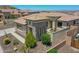 Stunning single-story home featuring desert landscaping, covered patio, and a fountain feature at 6914 W Juana Dr, Peoria, AZ 85383