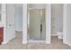 Bathroom with a glass-door shower and a tiled floor; toilet out of view at 6914 W Juana Dr, Peoria, AZ 85383