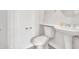 Clean half bathroom features a pedestal sink, toilet and towel rack with neutral wall color at 6914 W Juana Dr, Peoria, AZ 85383