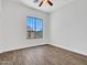 Bedroom with hard wood floor and view of fountain outside the window at 6914 W Juana Dr, Peoria, AZ 85383