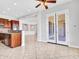 Open-concept area with tile flooring, access to backyard, and stainless steel appliances in the kitchen at 6914 W Juana Dr, Peoria, AZ 85383