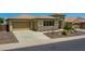 Beautiful one-story home featuring a well-maintained lawn, desert landscaping, and a private driveway at 6914 W Juana Dr, Peoria, AZ 85383