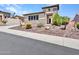 Charming single-Gathering home with stone accents, low maintenance landscaping, and a two car garage at 6914 W Juana Dr, Peoria, AZ 85383