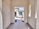 A glimpse through a stucco portal reveals a charming courtyard with a fountain at 6914 W Juana Dr, Peoria, AZ 85383