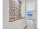 A hallway with decorative tile work opens up into the home's living room at 6914 W Juana Dr, Peoria, AZ 85383