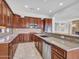 Updated kitchen featuring rich cabinetry, granite countertops and stainless steel appliances with tile floors at 6914 W Juana Dr, Peoria, AZ 85383