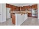 Updated kitchen with rich cabinetry, stainless steel appliances, granite countertops and breakfast bar at 6914 W Juana Dr, Peoria, AZ 85383