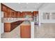 Updated kitchen with rich cabinetry, stainless steel appliances, granite countertops and breakfast bar at 6914 W Juana Dr, Peoria, AZ 85383