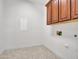 Laundry room with upper cabinet and visible connections for dryer at 6914 W Juana Dr, Peoria, AZ 85383
