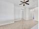 An open living room with tile floors and a ceiling fan at 6914 W Juana Dr, Peoria, AZ 85383