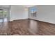 Open-concept living room featuring beautiful tile floors and natural lighting at 6914 W Juana Dr, Peoria, AZ 85383