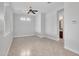 An empty living room with tile floors and a view into the bathroom at 6914 W Juana Dr, Peoria, AZ 85383