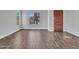 Bright living room with wood-look tile floors and entry to the house at 6914 W Juana Dr, Peoria, AZ 85383