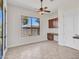 Office featuring a built-in desk and cabinet with a view of the backyard from the large window at 6914 W Juana Dr, Peoria, AZ 85383