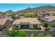 The backyard features a well maintained lawn, desert landscaping and nice shade features at 6914 W Juana Dr, Peoria, AZ 85383