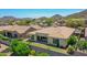 The backyard features a well maintained lawn, desert landscaping and nice shade features at 6914 W Juana Dr, Peoria, AZ 85383