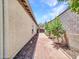 Side yard with gravel, pavers, and trees at 6914 W Juana Dr, Peoria, AZ 85383