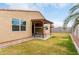 The backyard of this home features a covered patio, green grass, and desert landscaping at 7216 N 124Th Ln, Glendale, AZ 85307