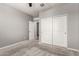 This is a simple carpeted bedroom with a closet that has sliding doors at 7216 N 124Th Ln, Glendale, AZ 85307
