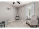 This cozy bedroom features soft gray walls and a large window for natural light at 7216 N 124Th Ln, Glendale, AZ 85307