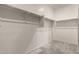 Walk-in closet with built-in shelving and carpet flooring at 7216 N 124Th Ln, Glendale, AZ 85307
