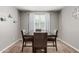Formal dining room featuring neutral paint, wood-look floors, and lots of natural light at 7216 N 124Th Ln, Glendale, AZ 85307