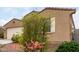 Charming single-story home featuring desert landscaping, a two-car garage, and a welcoming front entrance at 7216 N 124Th Ln, Glendale, AZ 85307