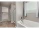 Main bathroom features a soaking tub, glass shower and separate closet at 7216 N 124Th Ln, Glendale, AZ 85307