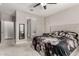 Bright main bedroom with neutral colors, ensuite bathroom and a ceiling fan at 7216 N 124Th Ln, Glendale, AZ 85307