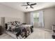 Bright main bedroom features a ceiling fan, plush carpet and neutral paint at 7216 N 124Th Ln, Glendale, AZ 85307