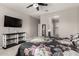 Spacious main bedroom with ensuite bathroom, ceiling fan and accent wall at 7216 N 124Th Ln, Glendale, AZ 85307