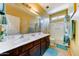 Bathroom with a double sink, mirror, and shower and tub combo at 7815 S 22Nd Ln, Phoenix, AZ 85041