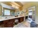 Bathroom featuring a large vanity with double sinks and a separate shower and tub area at 7815 S 22Nd Ln, Phoenix, AZ 85041