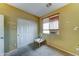 This bedroom has a window, blinds, and carpet flooring at 7815 S 22Nd Ln, Phoenix, AZ 85041