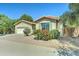 Inviting single-story home featuring gravel landscaping, shutters, and mature trees at 7815 S 22Nd Ln, Phoenix, AZ 85041