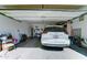 Attached garage with a white vehicle and storage items at 7815 S 22Nd Ln, Phoenix, AZ 85041
