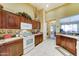 Kitchen area offers white appliances, wood cabinetry, and a convenient layout at 7815 S 22Nd Ln, Phoenix, AZ 85041