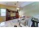 Comfortable living room space with neutral carpet, ceiling fan, and entertainment center at 7815 S 22Nd Ln, Phoenix, AZ 85041