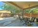 Covered outdoor patio area with a table and chairs at 7815 S 22Nd Ln, Phoenix, AZ 85041