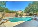 Refreshing backyard pool area with stone accents at 7815 S 22Nd Ln, Phoenix, AZ 85041