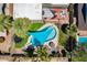 Overhead aerial view highlighting a backyard pool, trampoline, shaded patio, and lush landscaping, creating a serene retreat at 8307 E Buena Terra Way, Scottsdale, AZ 85250