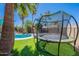 Backyard trampoline and pool offer outdoor recreation and fun in a lush, landscaped setting, perfect for active enjoyment at 8307 E Buena Terra Way, Scottsdale, AZ 85250