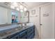 Stylish bathroom boasts a vessel sink, granite countertop, and decorative lighting fixture at 8307 E Buena Terra Way, Scottsdale, AZ 85250