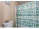 Cozy bathroom features a cactus-themed shower curtain and toilet with a cream-colored tank at 8307 E Buena Terra Way, Scottsdale, AZ 85250