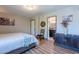 Well-lit bedroom includes a bed, stylish decor, and convenient access to the ensuite bathroom at 8307 E Buena Terra Way, Scottsdale, AZ 85250