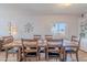 Inviting dining area featuring a wood table with views of built-in shelving and decor at 8307 E Buena Terra Way, Scottsdale, AZ 85250