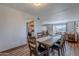 Open-concept dining area with a wood table, chairs, views of the kitchen, and seamless transition to living area at 8307 E Buena Terra Way, Scottsdale, AZ 85250