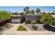 Charming home featuring xeriscape landscaping, and an attached garage, providing comfortable living and a welcoming curb appeal at 8307 E Buena Terra Way, Scottsdale, AZ 85250