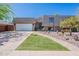 Charming home with manicured lawn, desert landscaping and a spacious two-car garage at 8307 E Buena Terra Way, Scottsdale, AZ 85250
